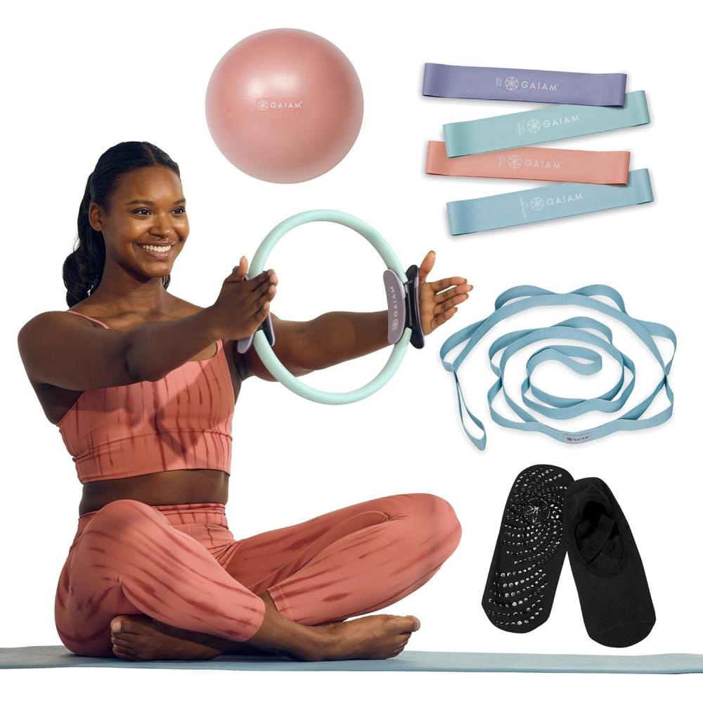 imageGaiam Home Pilates Kit AllinOne Workout Set with Mini Bands 12Inch Flexible Toning Ring 8Inch Ab Core Ball Stretch Strap Grippy Socks amp Mesh Carry Bag Pilates Kit for Home Workouts